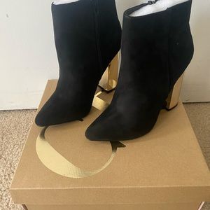 Charlotte Russe black boots with shiny gold heel. Brand new. Never worn.